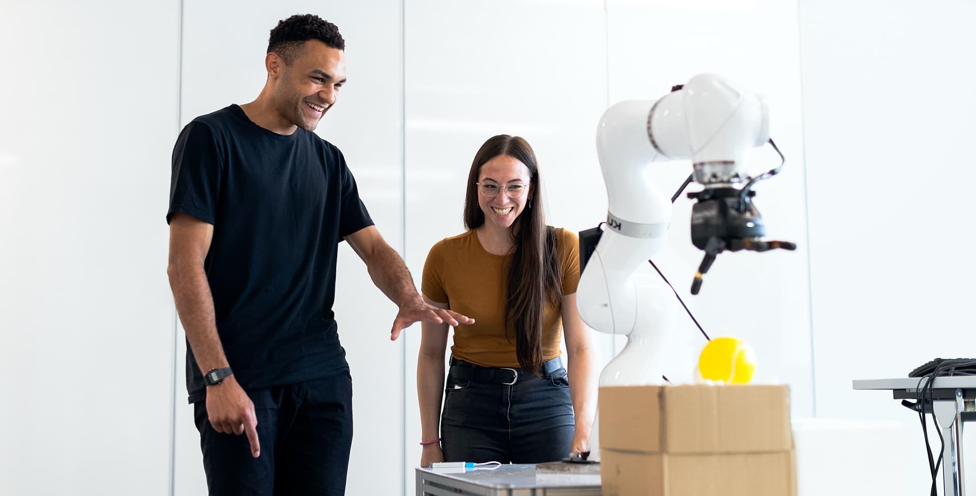 Students looking at machine