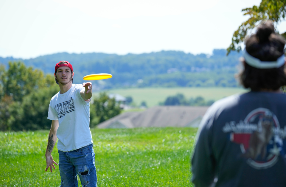 A picture of students playing frisbee.